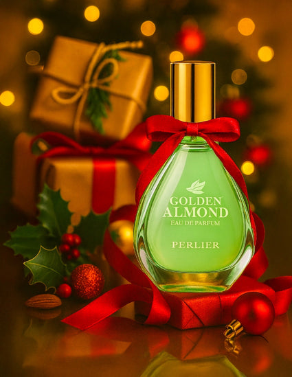Perlier Golden Almond perfume bottle with a red ribbon against a festive background with gifts and decorations.