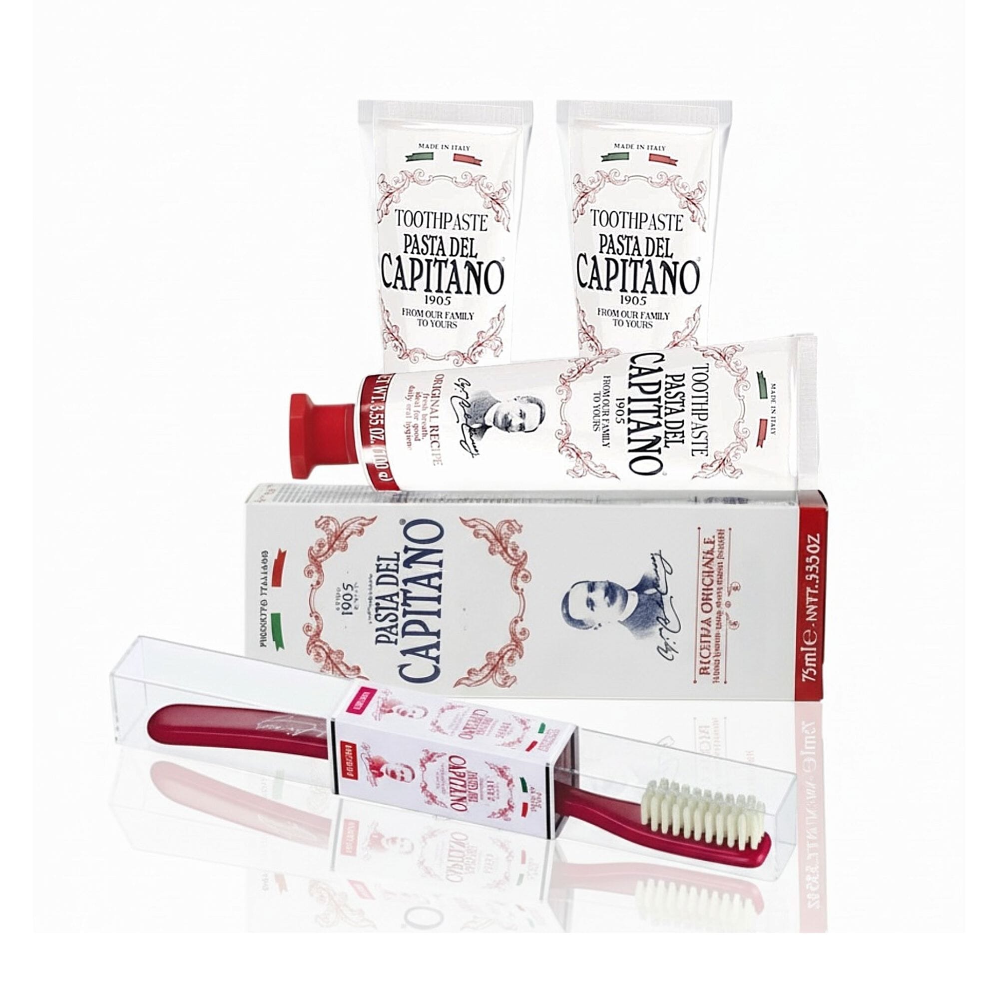 3 tubes of Pasta del Capitano Original Recipe toothpaste and toothbrush on a white background
