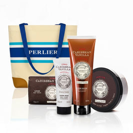 4 Perlier Caribbean Vanilla body care products in front of a striped tote bag on a white background