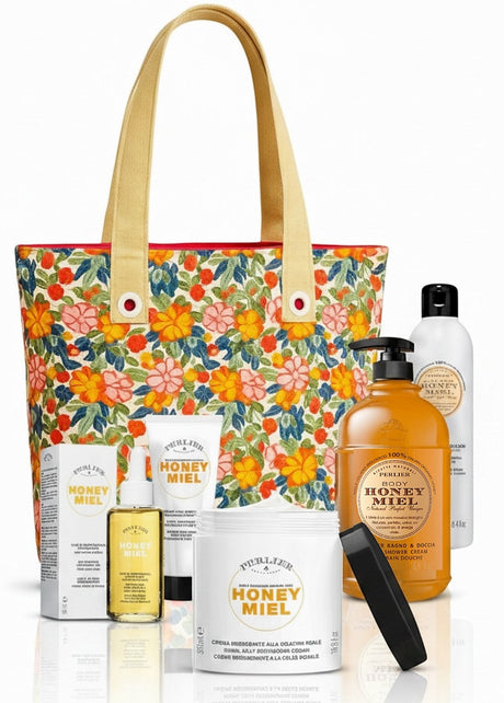 5 Perlier Honey Miel body care products and a floral tote bag on a white background