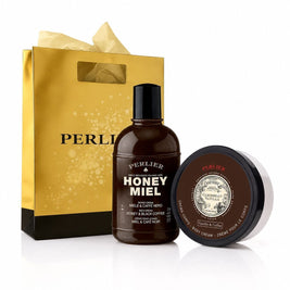 A gift set featuring a Perlier Honey Miel Coffe body wash and a Caribbean Vanilla Coffe body cream, and a gold gift bag on a white background.