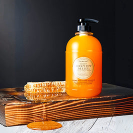 Original Honey Miel Bath & Shower Cream with honeycomb on a wooden surface